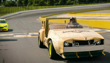 Sasquatch in a wooden racecar